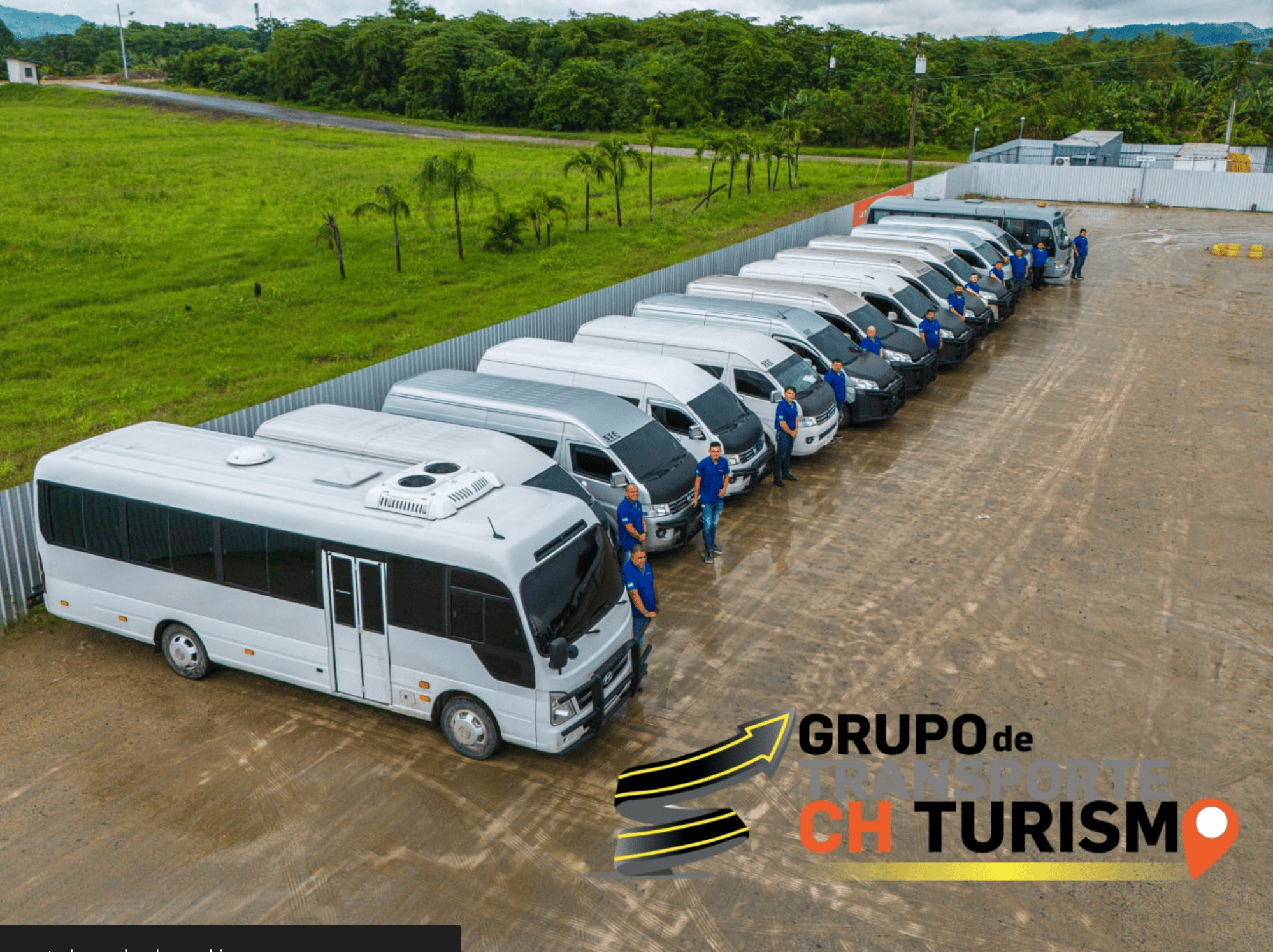 Two women sitting at a modern table talking with a city view behind them.